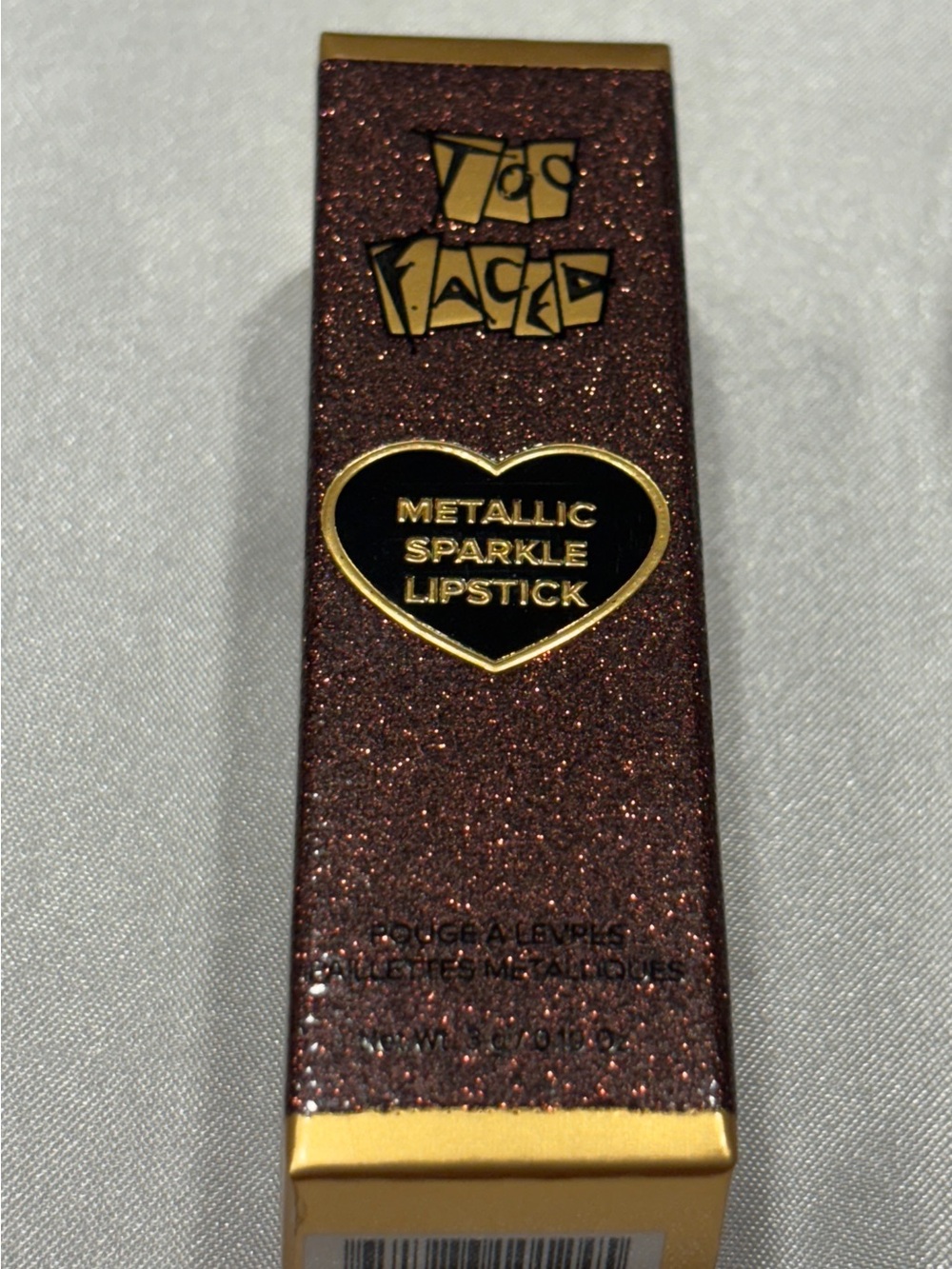 Too Faced Metallic Sparkle Lipstick in shade “THAT GIRL”